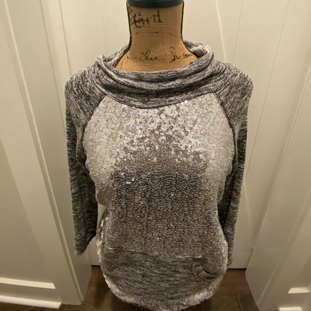 cute (total girl sweater) like material with sparkles on the front.
